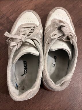 Well-worn women’s sneakers used shoes - size 9